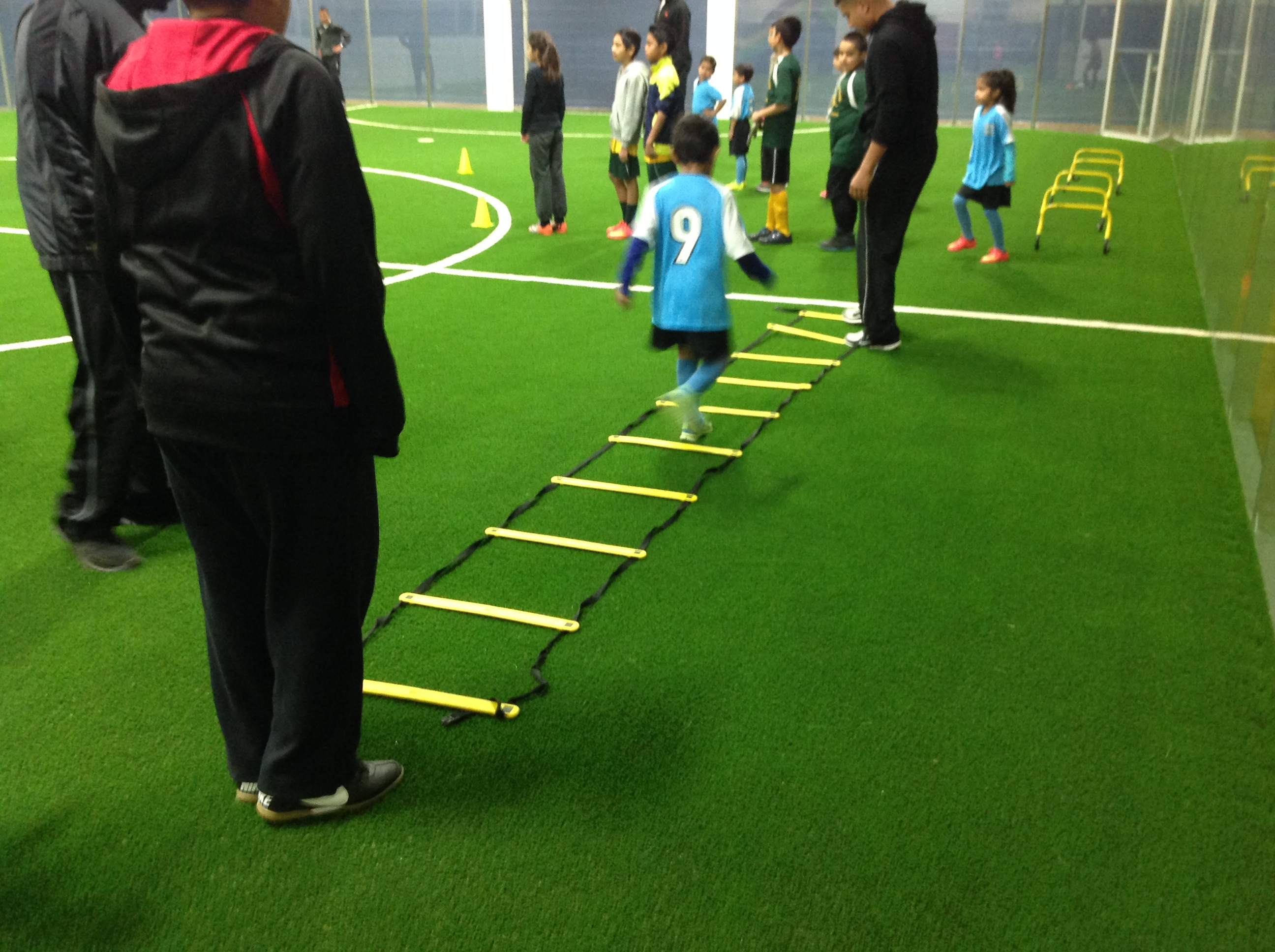 Child participating in soccer drills